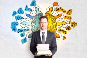 A man in a suit holds a stack of books, standing between two colorful brain illustrations surrounded by motivational words and symbols.